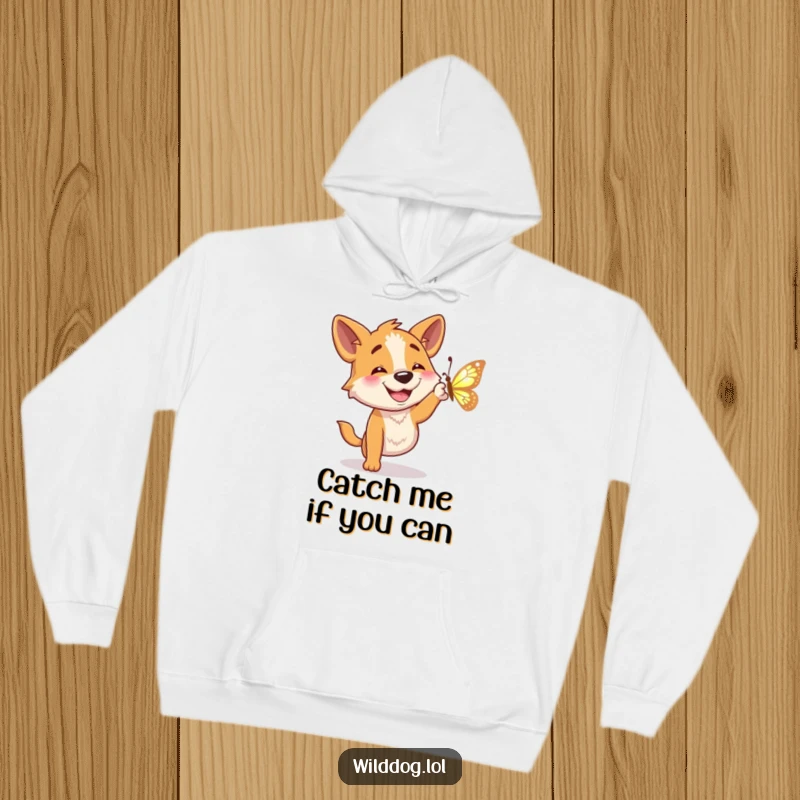 Funny hoodie showcasing a joyful wild dog character with a big grin trying to catch a sparkling butterfly.