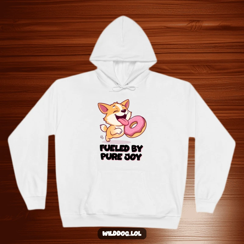 Funny hoodie with a joyful dog with its tongue out, chasing a rolling donut, offering cozy comfort with a fun design.