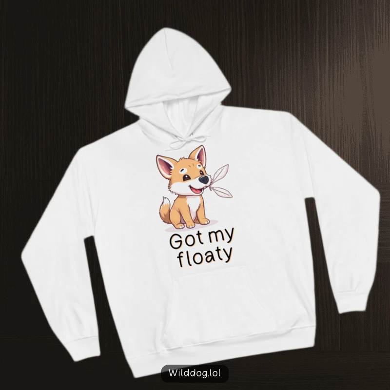 Funny wild dog attempting to catch a floating feather with its snout, featured on a warm hoodie for ultimate cozy humor.