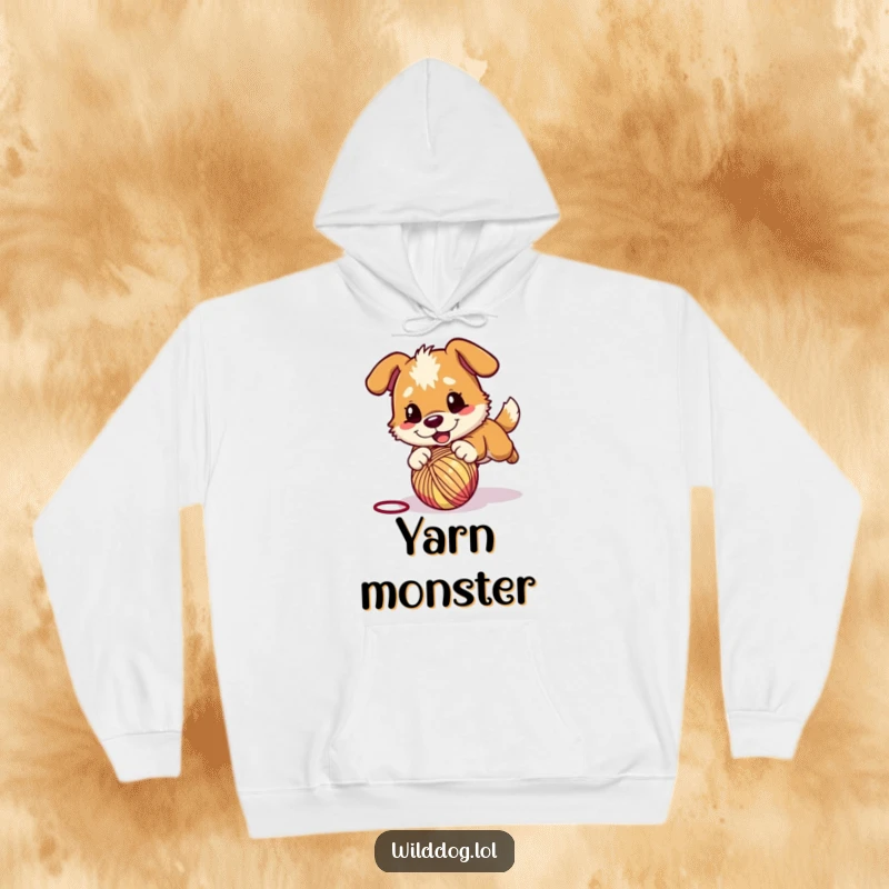 Funny hoodie featuring a wild dog character playfully pouncing on a bouncing ball of yarn, designed for comfort and fun.
