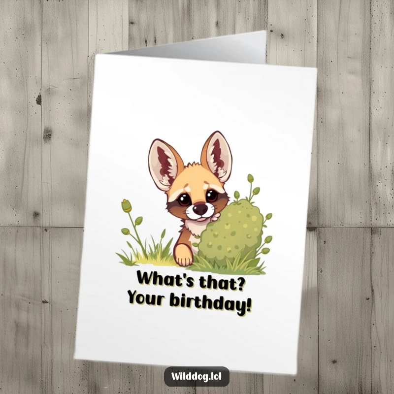 Funny free printable birthday card showing a curious wild dog peeking from behind a leafy green bush with alert, perked-up ears.
