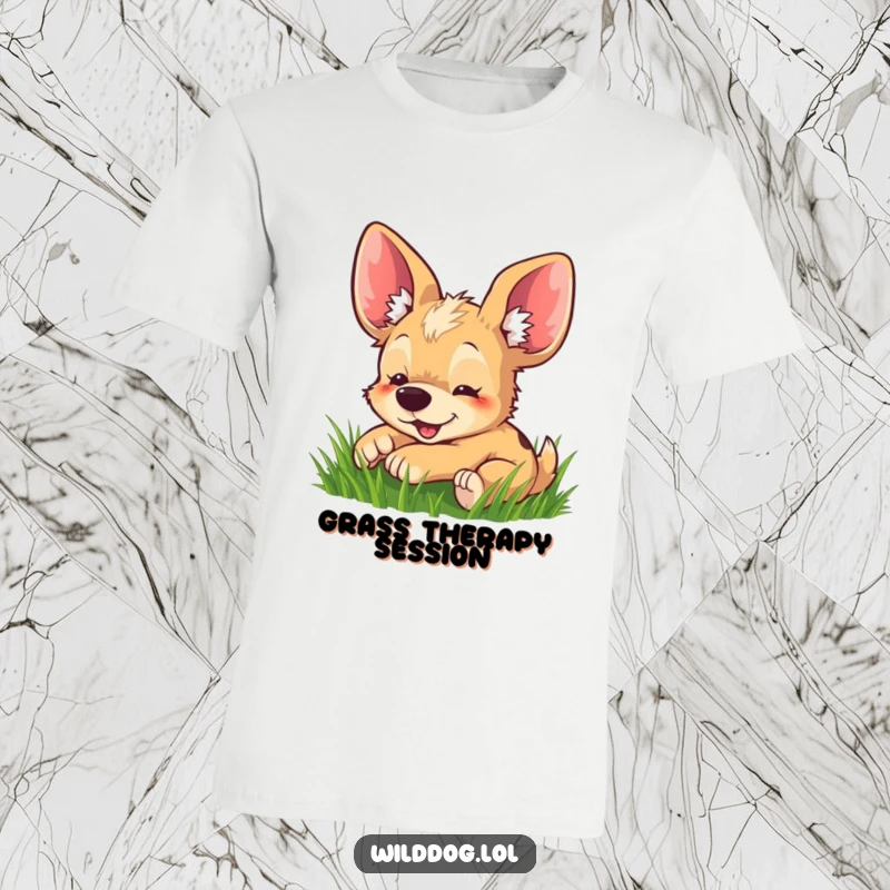 Funny t-shirt depicting a happy wild dog with comically large ears joyfully rolling around in a patch of green grass.