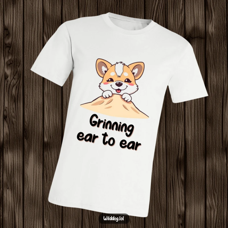 Funny wild dog with a silly grin peeking over a small hill on a t-shirt, radiating playful joy.