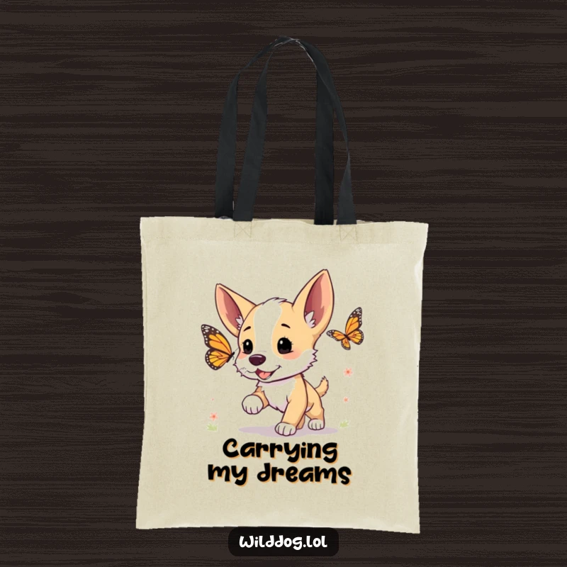 Funny tote bag showing a cute wild dog puppy eagerly chasing a butterfly with its ears perked up.